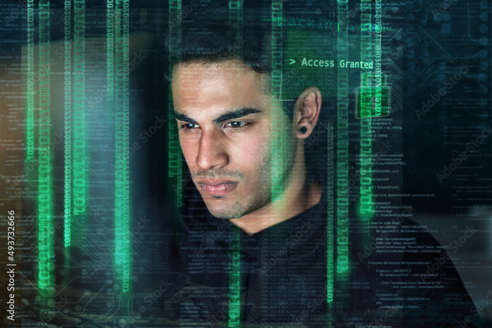 Poster living his life by numbers. shot of a young hacker cracking a computer code in the dark.