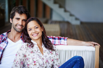 Relaxing together and enjoying the moment. A loving young couple spending time together at home.