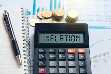  INFLATION word on the calculator.The concept of decreasing purchasing power. inflation. the idea for FED considers interest rate hikes, world economics, and inflation control,