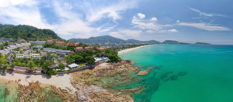 Aerial view panorama image of Patong bay at phuket island. Beautiful island in thailand Amazing High angle view Island seashore with blue sky cloudy sky over sea background Travel holiday Concept