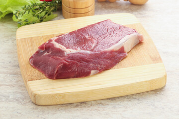 Raw rib-eye beef steak black angus