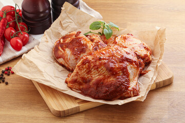 Marinated chicken leg in tomato sauce