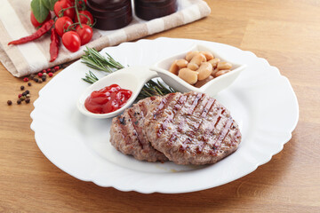 Grilled beef burger cutlet with sauce