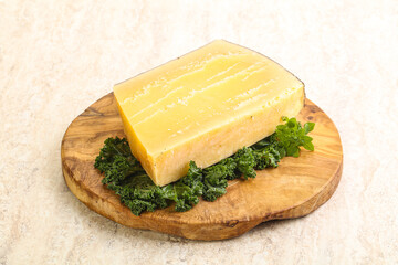 Parmesan cheese piece over board