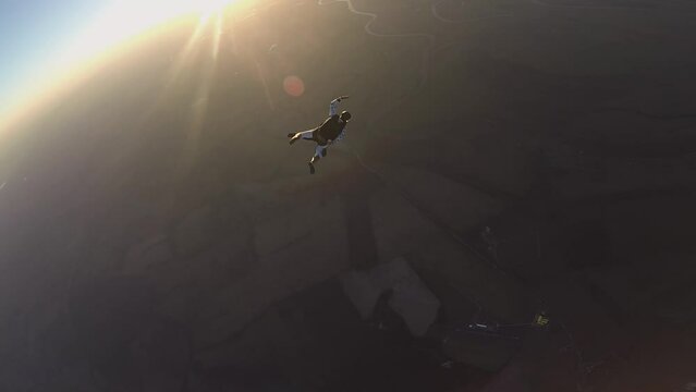 skydiving, free fall, a man in the clouds, parachutists jump out of an airplane, tandem