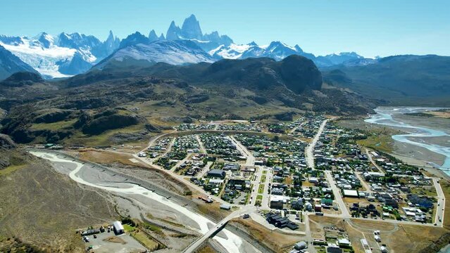 Mount Fitz Roy in El Chalten, Patagonia, Argentina. Top cinematic aerial view. Small cozy village among huge mountains and beautiful river