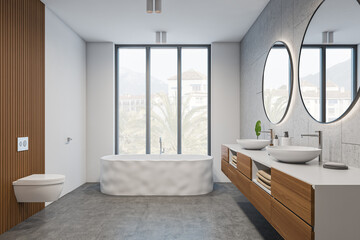 Front view on bright bathroom interior with bathtub, panoramic window