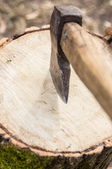 Chopping wood to heat a house in Ukraine at war with Russia