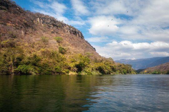 Sumidero Canyon is a deep natural canyon located on the Grijalva River in Chiapas in Southern Mexico. The Canyon's vertical walls can reach up to 1,000 meters high and it is covered with rainforest.