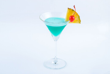 Blue hawaii with pineappale. Beverage for summer with white background.
