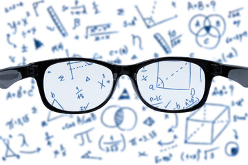 Sight test seen through eye glasses with blurry Mathematics chart.