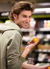 I want this one. A young man at the store buying fruit.