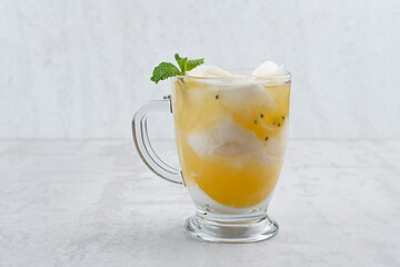 Es Kelapa Jeruk, a typical Indonesian drink made from fresh oranges squeezed with grated young coconut.
