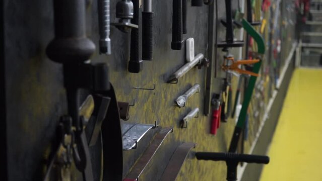a beautifully laid out tool for carrying out car body repair in a car service station, restoration of defective and broken cars by a master, repair garage, auto tuning place