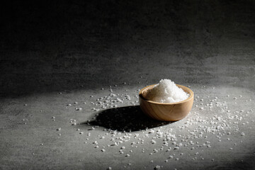 Close-up of sea salt in wooden bowl.