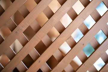 texture of a decorative lattice made of wood, surface and pattern of wood, wooden slats.