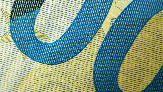 Paper money, euro, fiat money. Stop motion, macro view of parts of banknotes as a financial background. Light zoom. Financial and business success as a concept. Currency cash animation.