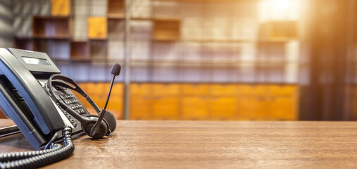 Obraz premium Headset and customer support equipment at call center ready for actively service , Communication support, call center and customer service help desk.for (call center) concept .