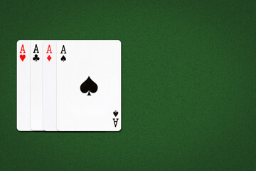 Four Aces on a green poker background. Gamble.Copy Space. Playing cards.