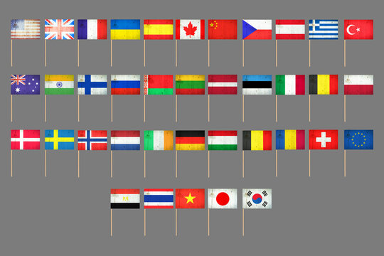 Set of grunge flags on a stick. Isolated on a gray background. Design element. Signs and symbols.