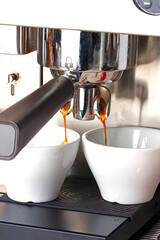 espresso machine pouring coffee on the table