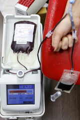 Blood donor. Preparation and donation of blood for the needs of patients. A woman takes blood for...