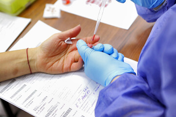 Blood donor. Preparation and donation of blood for the needs of patients. A woman takes blood for...