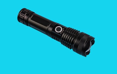 modern black metal flashlight isolated on white