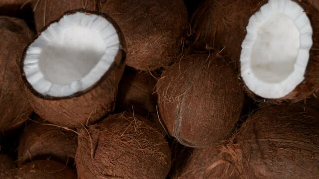 Cracked coconut falling, super slow motion filmed on high speed cinematic camera at 1000 fps.