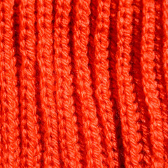 Handmade knitted fabric orange wool background texture