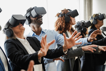 Multiracial teamwork having fun wearing virtual reality headset inside business office - Focus on...