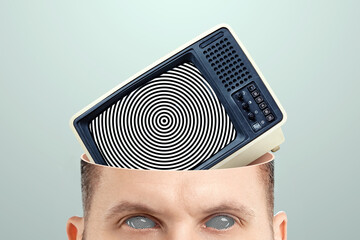 Television zombifies people through propaganda, a man zombified by a TV. Manipulation of the crowd...