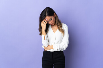 Fototapeta premium Young caucasian woman isolated on purple background with headache