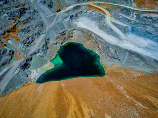 drone aerial photo of flooded mosfiloti quarries in Cyprus, green lakes near copper mine, quarry