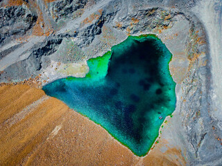 drone aerial photo of flooded mosfiloti quarries in Cyprus, green lakes near copper mine, quarry