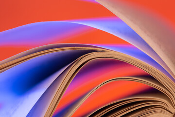 Open book close up macro photo. Wisdom and education concept.Love reading. Retro neon light 90s