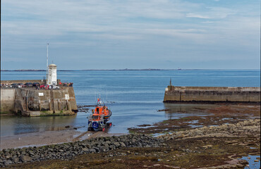 The Shannon Class Lifeboat being launched using its Tracked launch Vehicle approaching the harbour...