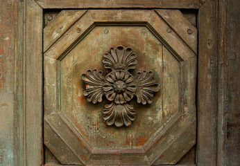 Wooden flower pattern-manual woodcarving on door.