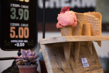 Strawberry ice cream in a cone