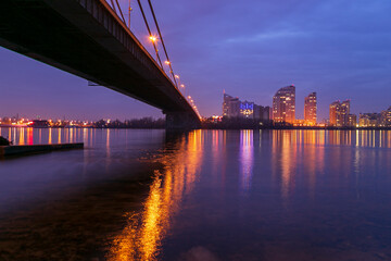 The Southern Bridge across the Dnieper in Kiev, the capital of Ukraine. Blue hour, sunset