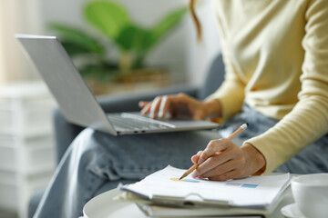 Businesswoman hands hold documents with laptop financial statistic stock photo,discussion and analysis data the charts and graphs. Finance concept