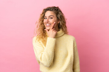Young blonde woman isolated on pink background happy and smiling