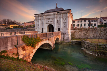 Treviso, Italy. Cityscape image of Treviso, Italy with gate to old city at sunset.