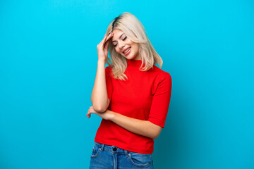 Young Russian woman isolated on blue background laughing