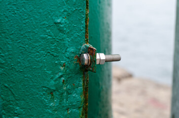 Rusty metal surface. Painted iron. Peeling old paint. Rust structure. Closed door.