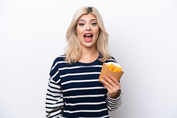 Young Russian woman catching french fries isolated on white background with surprise and shocked facial expression