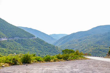 narrow road in mountains in georgia in summer