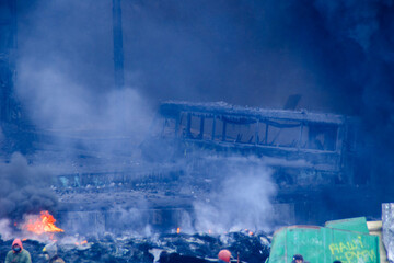 Burnt bus during protests in Kyiv