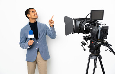 Reporter African American man holding a microphone and reporting news over isolated white background pointing with the index finger a great idea