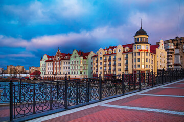 Colored houses on the central embankment in the evening in Kaliningrad.